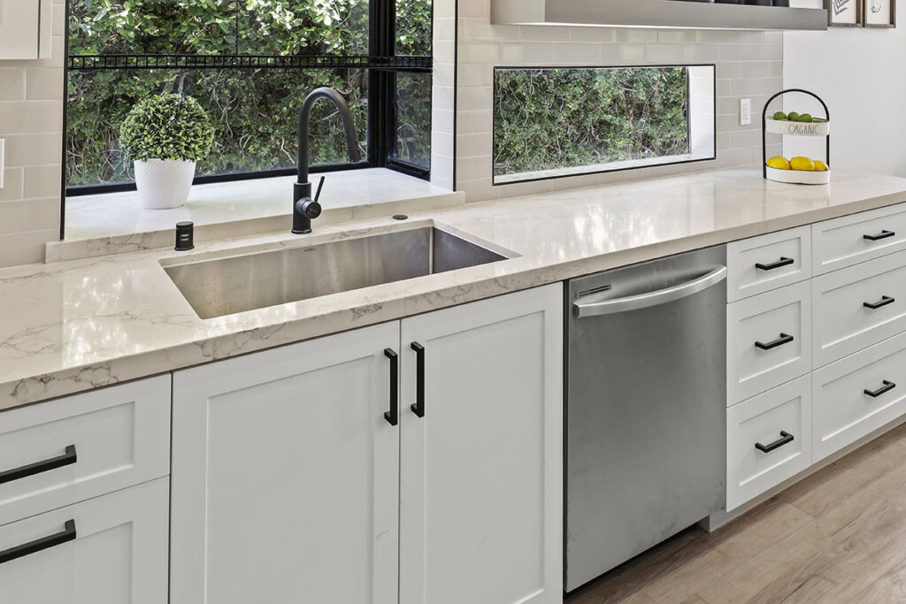 Painted white shaker cabinet kitchen with marble counters by ATA Custom Cabinets in Los Angeles