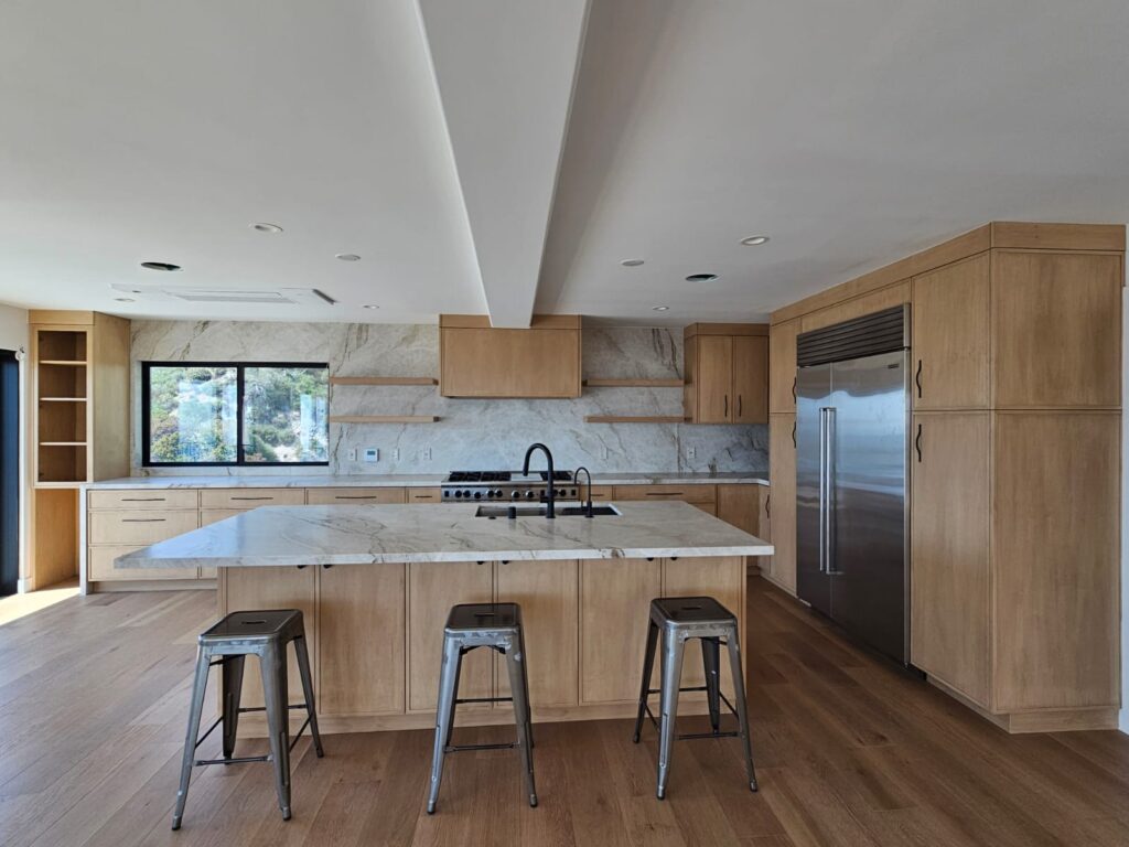 White oak slim shaker kitchen with marble waterfall island built by ATA Custom Cabinets in Los Angeles